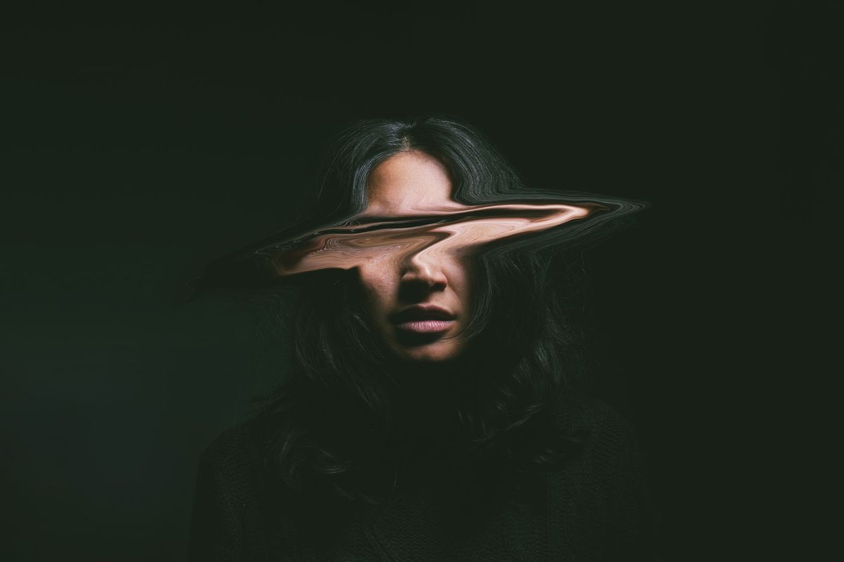 Young woman with her face distorted (Getty Images/PeopleImages)