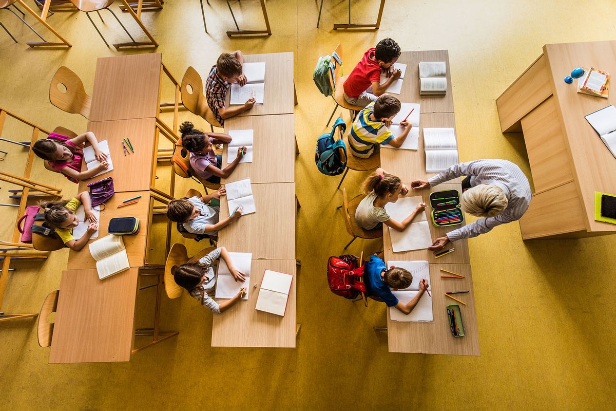 Above view of a class at elementary school (Getty Images/skynesher)