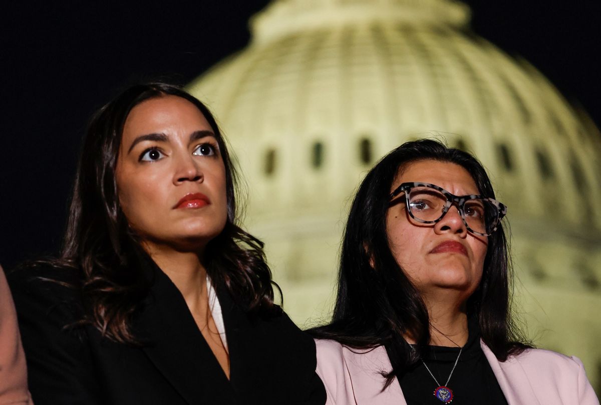 Rep. Alexandria Ocasio-Cortez (D-NY), and Rep. Rashida Tlaib (D-MI) listen during a news conference calling for a ceasefire in Gaza outside the U.S. Capitol building on November 13, 2023 in Washington, DC.  (Anna Moneymaker/Getty Images)
