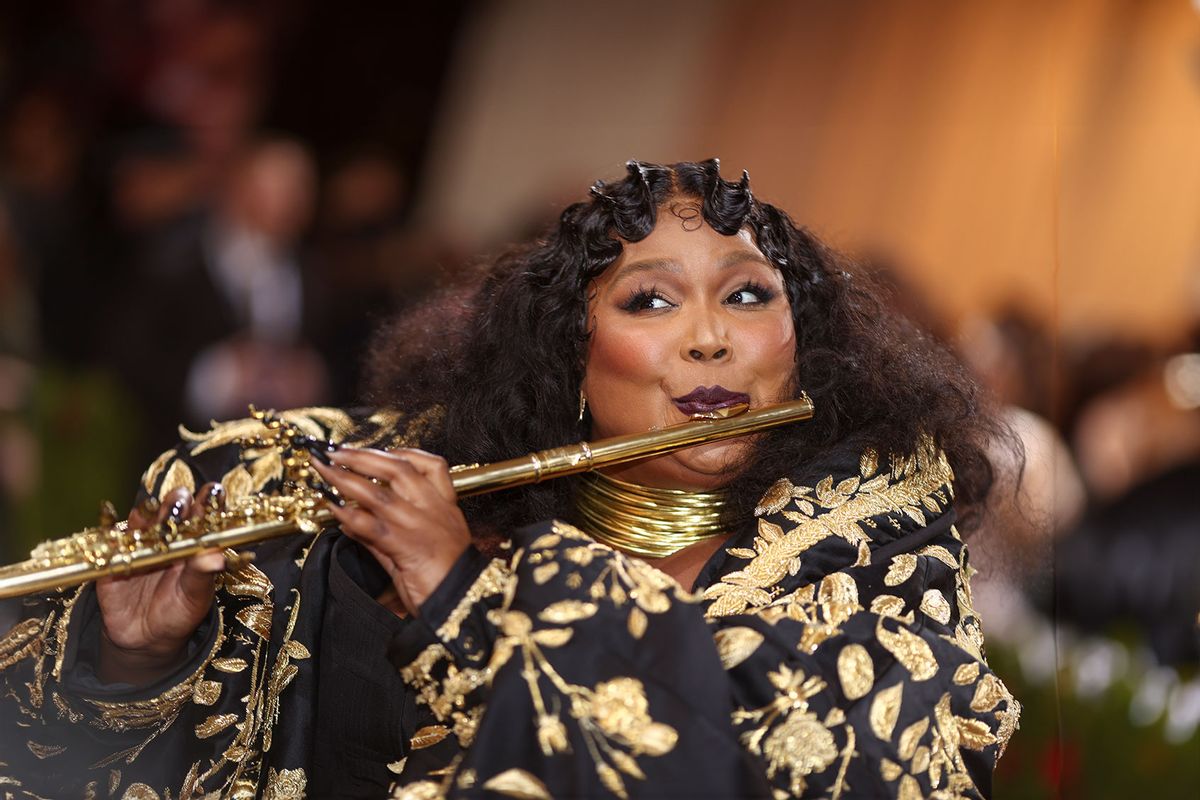 Lizzo in plays the flute in custom Thom Browne and at the 2022 Met Gala celebrating In America: An Anthology of Fashion held at The Metropolitan Museum of Art on May 2, 2022 in New York City. (Chris Polk/WWD/Penske Media via Getty Images)