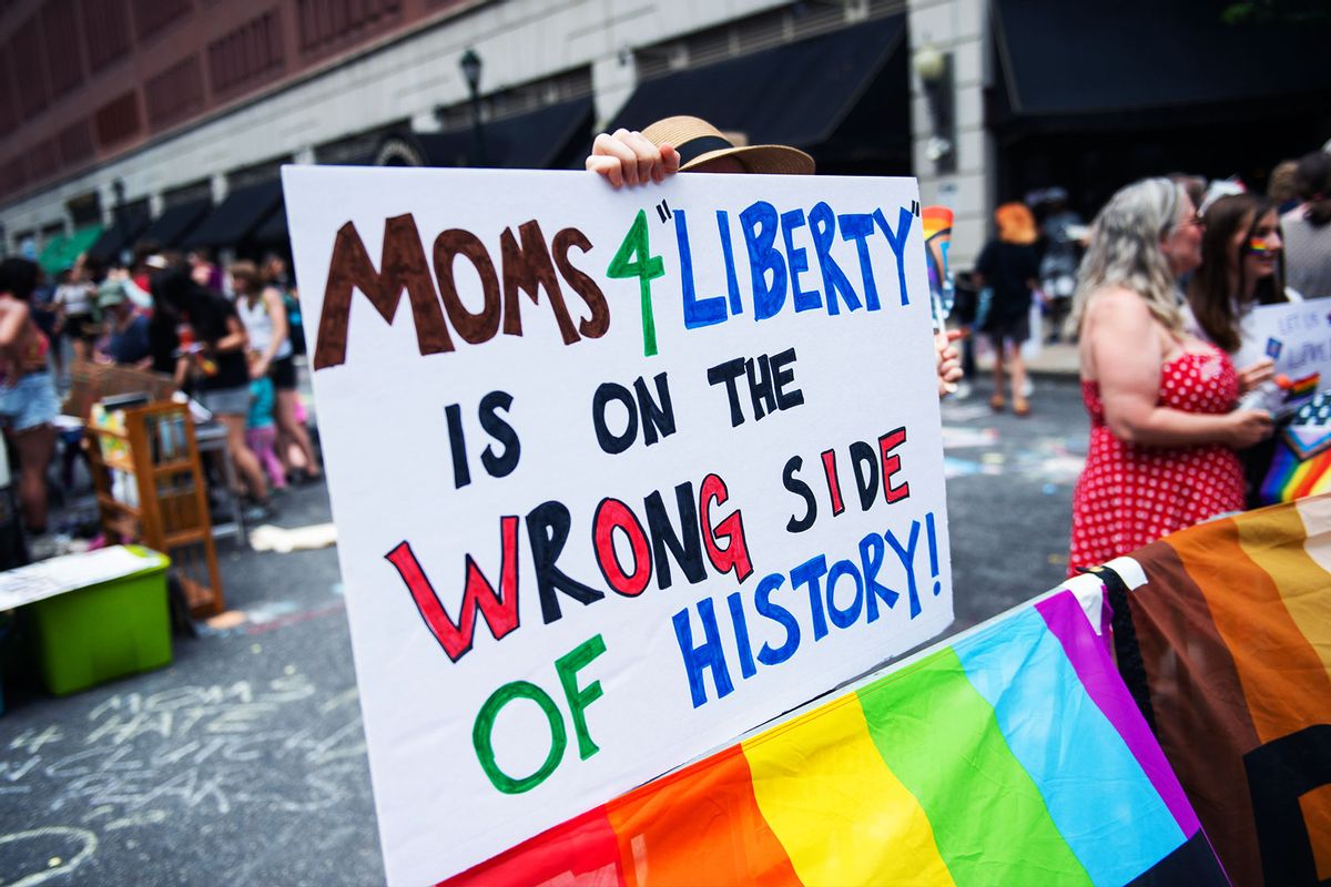 A protester holds a placard during a protest held by Philly Children's Movement against Moms For Liberty in Center City Philadelphia. (Matthew Hatcher/SOPA Images/LightRocket via Getty Images)
