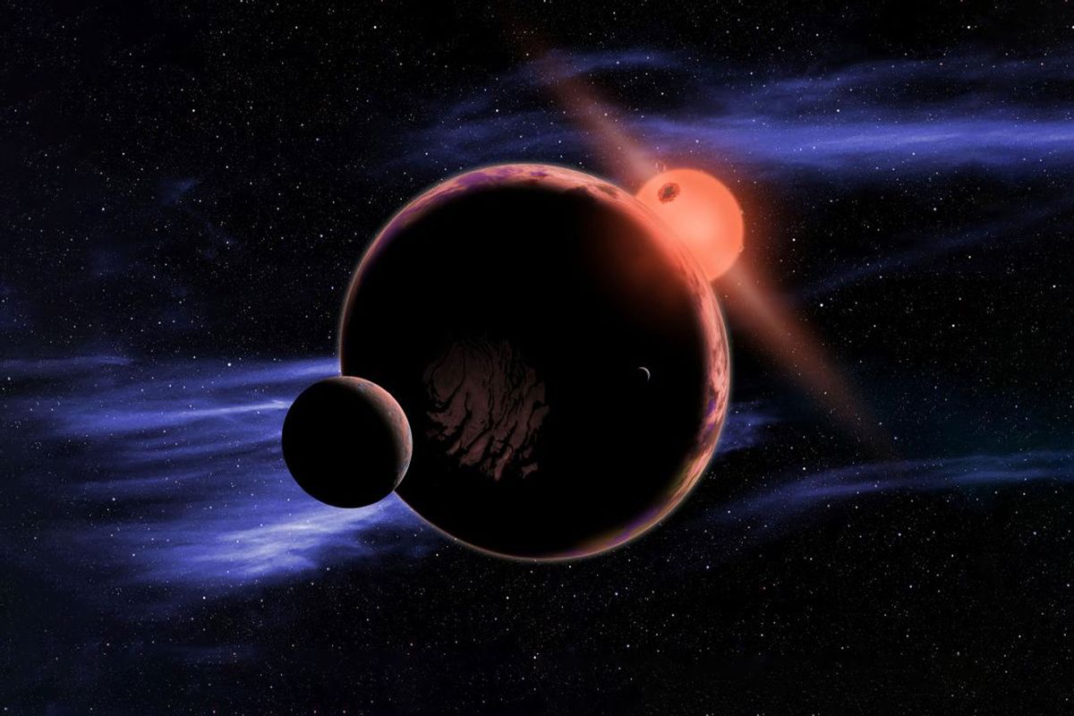 The artist's conception shows a hypothetical planet with two moons orbiting in the habitable zone of a red dwarf star. (NASA/D. Aguilar/Harvard-Smithsonian Center for Astrophysics)