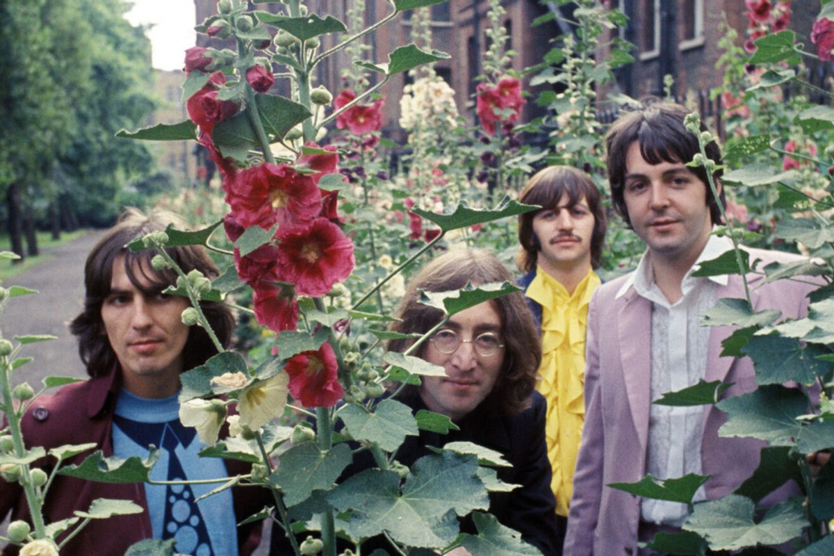 The Beatles during a photo session, St Pancras Old Church gardens, London, 28 July 1968. (Apple Corps Ltd.)