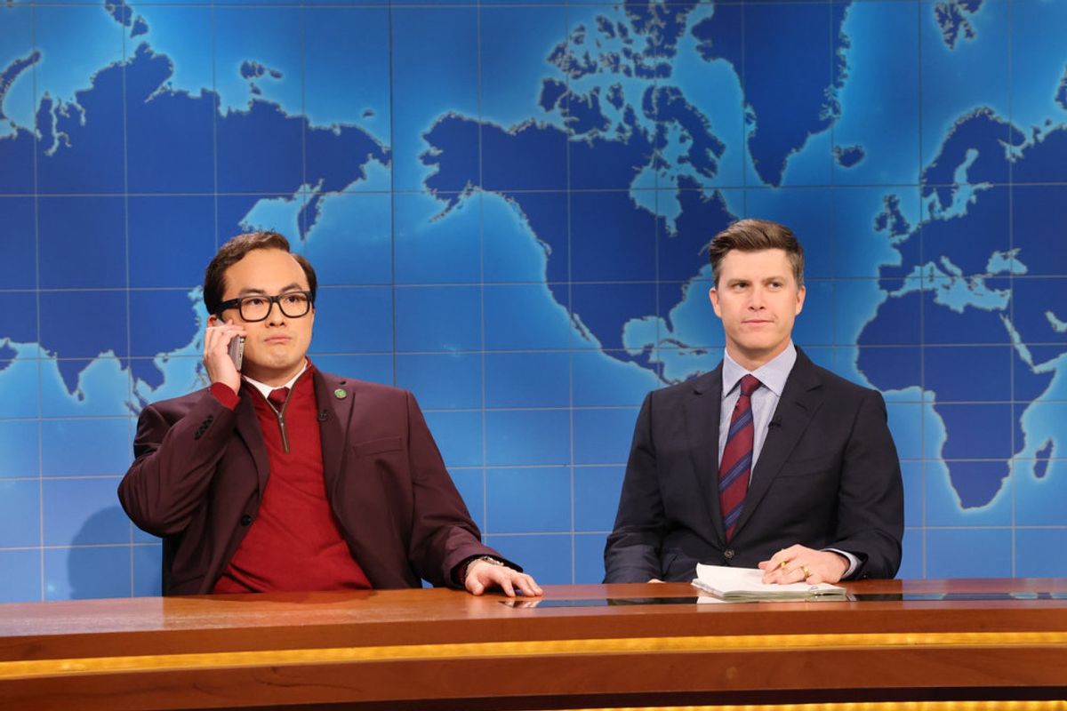(l-r) Bowen Yang as Rep. George Santos and Anchor Colin Jost during Weekend Update on "Saturday Night Live," November 18, 2023 (Will Heath/NBC)