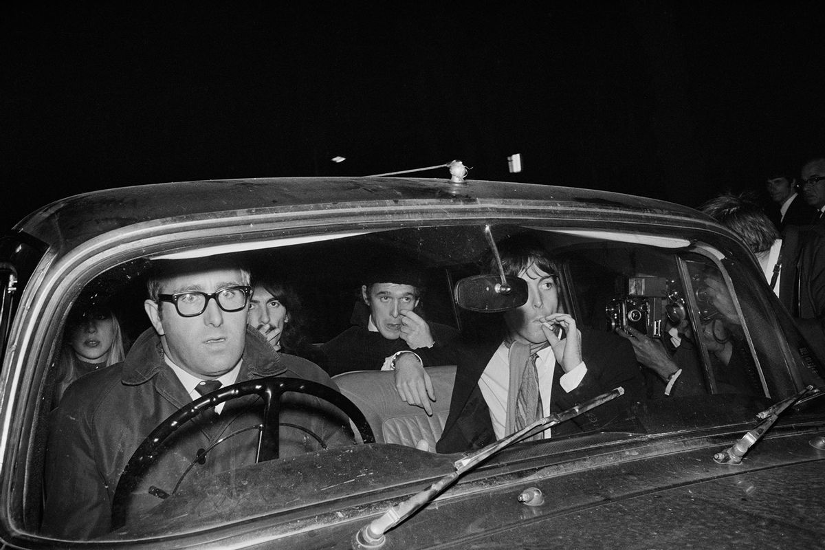 The Beatles on their way to a memorial service for their manager Brian Epstein, UK, 17th October 1967. From left to right, Patti Boyd, Mal Evans, George Harrison, Neil Aspinall and Paul McCartney. (Clive Limpkin/Daily Express/Getty Images)