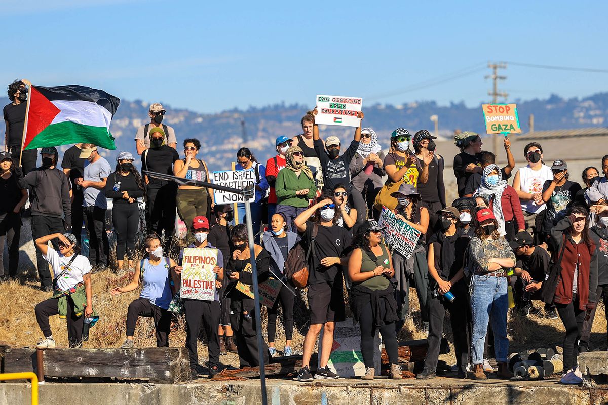 Pro-Palestinian protesters chant after they blocked the entrance at Bert 20 to delay the departure of Cape Orlando ship from the Port of Oakland in Oakland, Calif., on Friday, Nov. 3, 2023. (Ray Chavez/MediaNews Group/The Mercury News via Getty Images)