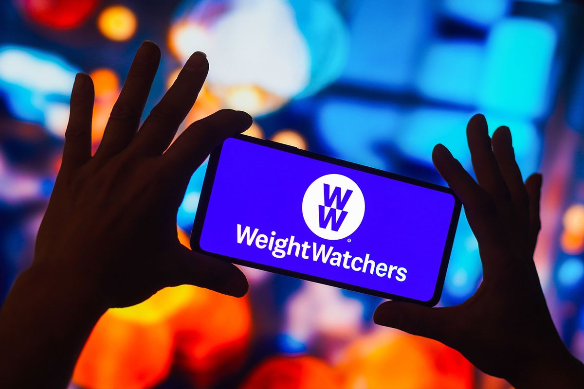 The Weight Watchers (WW International) logo is displayed on a smartphone screen. (Photo Illustration by Rafael Henrique/SOPA Images/LightRocket via Getty Images)