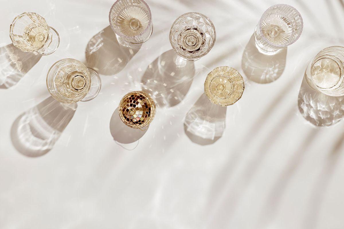 Holiday event drinks and disco ball (Getty Images/yrabota)