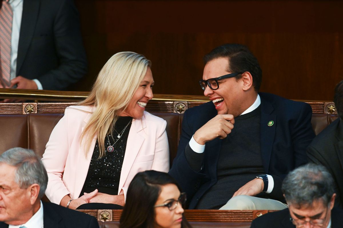 Rep.-elect Marjorie Taylor Greene (R-Ga.) laughs with Rep.-elect George Santos (R-N.Y.) voting for speaker continues for a third day during a meeting of the 118th Congress, Thursday, January 5, 2023, at the U.S. Capitol in Washington DC. (Matt McClain/The Washington Post via Getty Images)