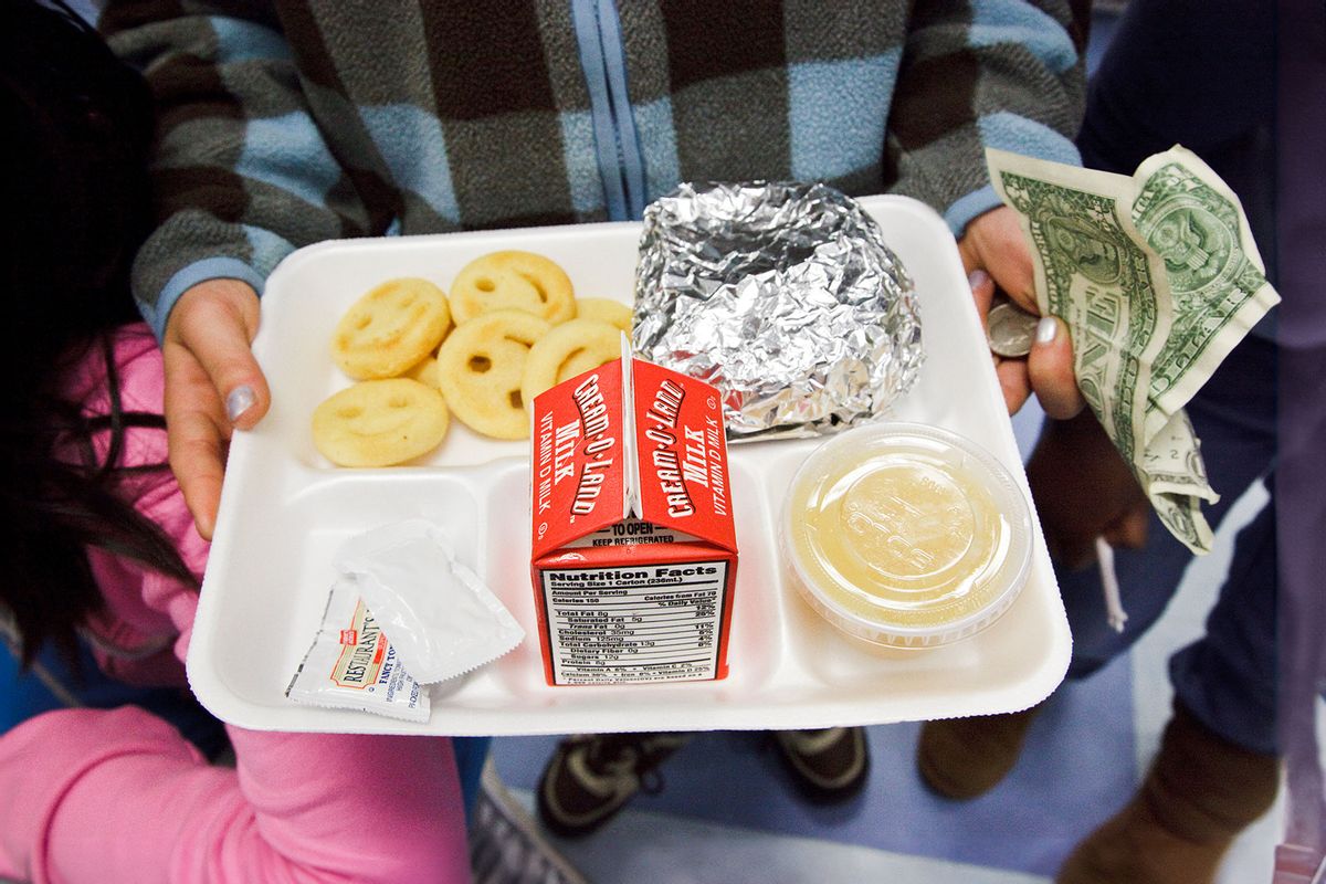 School lunch at a public elementary school in New Jersey: hamburger; milk, apple sauce and smiley faced french fries. (James Leynse/Corbis via Getty Images)