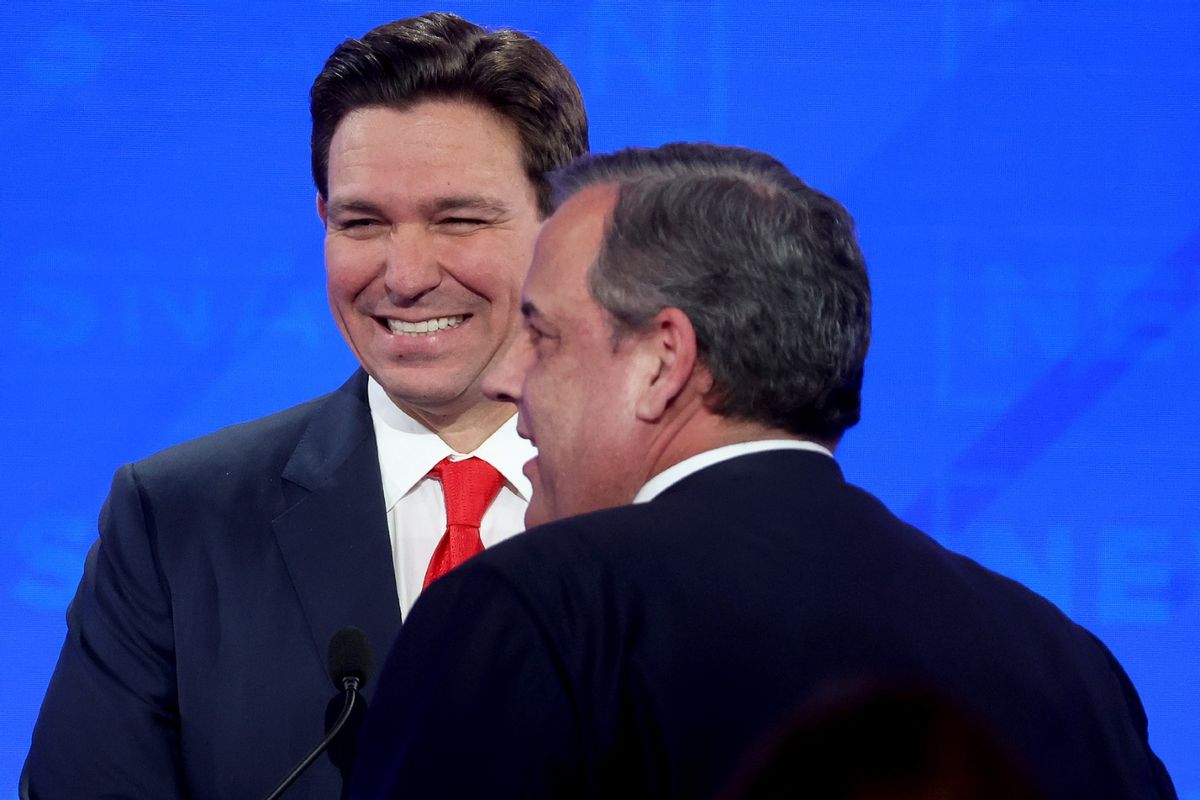 Republican presidential candidates Florida Gov. Ron DeSantis (L) and former New Jersey Gov. Chris Christie talk during a commercial break in the NewsNation Republican Presidential Primary Debate at the University of Alabama Moody Music Hall on December 6, 2023 in Tuscaloosa, Alabama.  (Justin Sullivan/Getty Images)