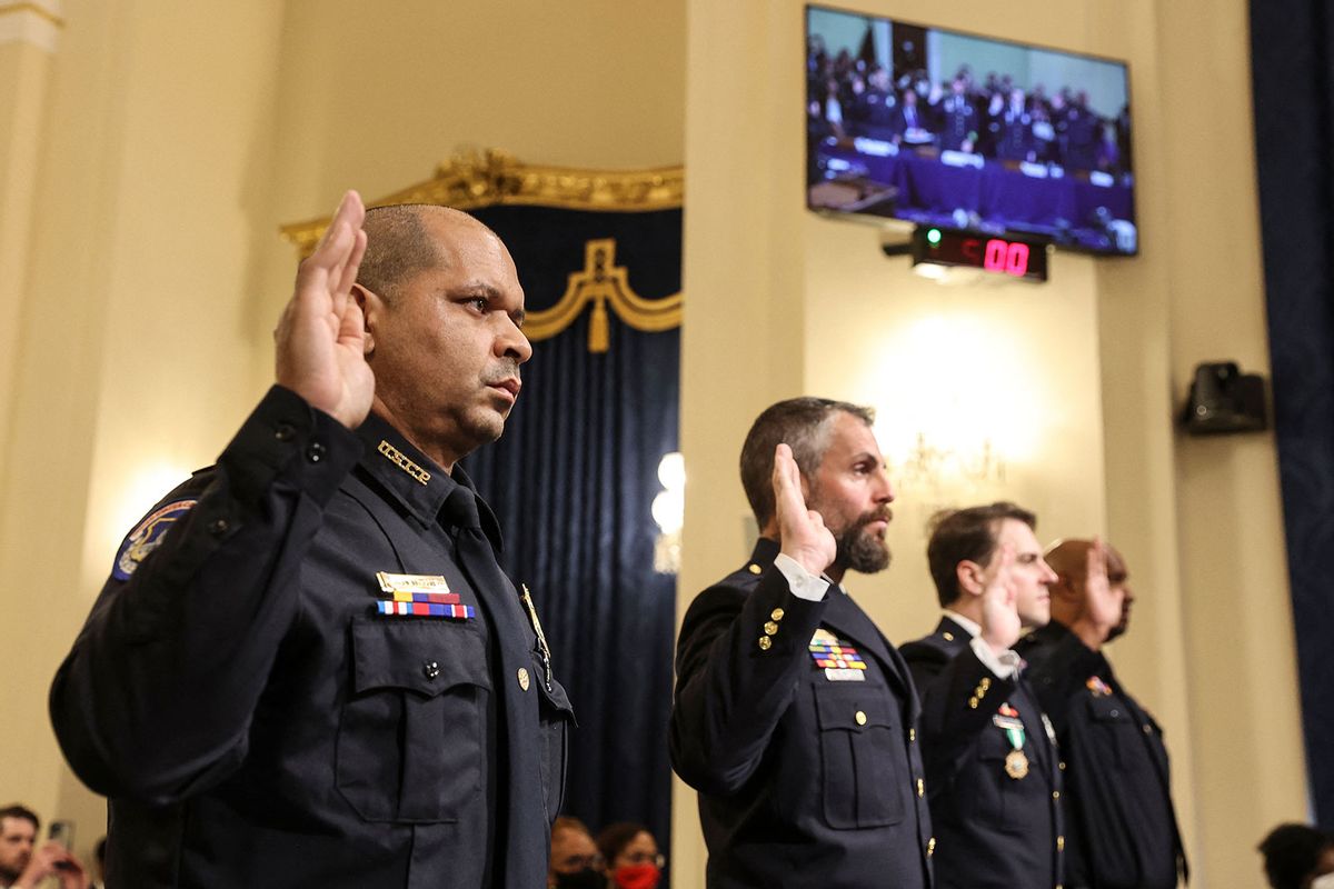 US Capitol Police officer Sgt. Aquilino Gonell, DC Metropolitan Police Department officer Michael Fanone, DC Metropolitan Police Department officer Daniel Hodges and US Capitol Police officer Harry Dunn are sworn-in before testifying during the Select Committee investigation of the January 6, 2021, attack on the US Capitol, during their first hearing on Capitol Hill in Washington, DC, on July 27, 2021. (OLIVER CONTRERAS/POOL/AFP via Getty Images)