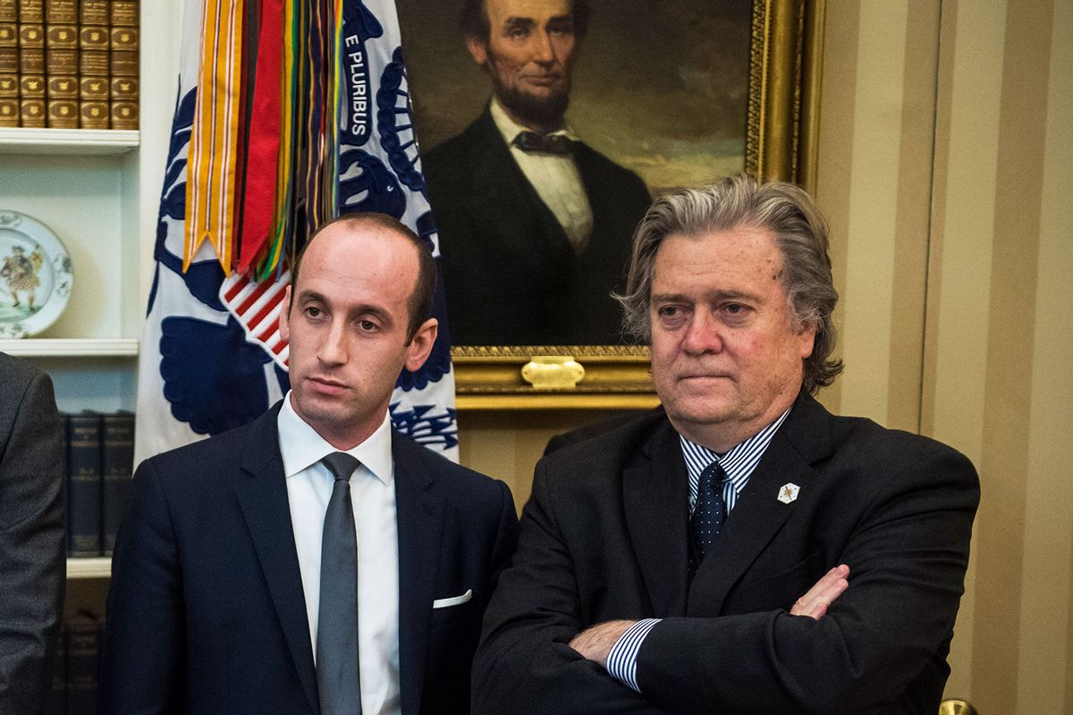 Policy adviser Stephen Miller, and chief strategist Steve Bannon watch as President Donald Trump talks about an executive memorandum on investigation of steel imports before signing the document in the Oval Office of the White House in Washington, DC on Thursday, April 20, 2017. (Jabin Botsford/The Washington Post via Getty Images)