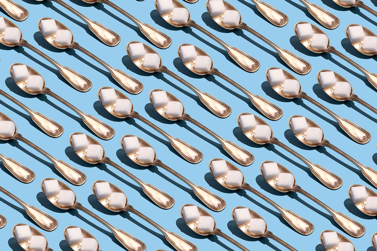 Sugar cubes in metallic spoons (Getty Images/Yulia Reznikov)