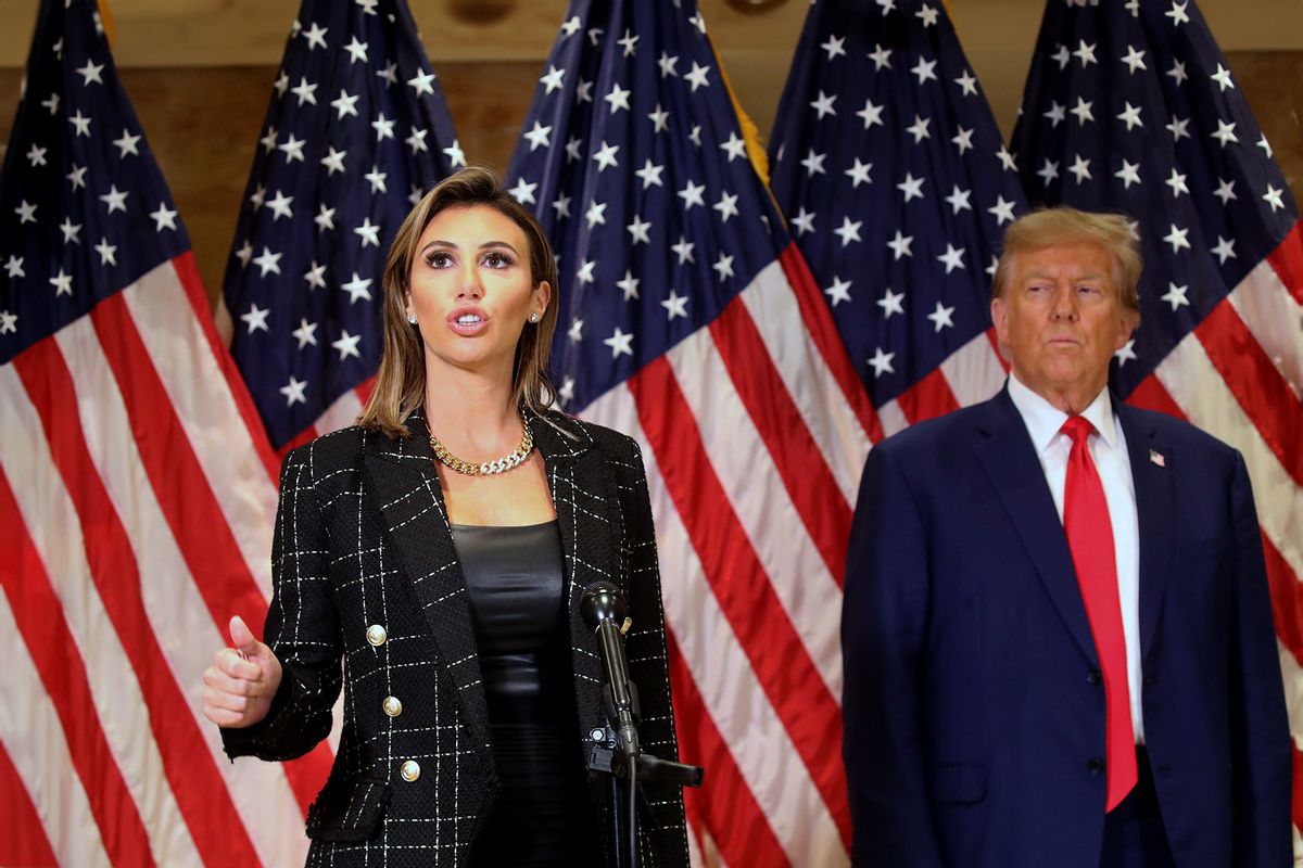 Former U.S. President Donald Trump stands with his lawyer Alina Habba as she speaks to the media at one of his properties, 40 Wall Street, following closing arguments at his civil fraud trial on January 11, 2024 in New York City. (Spencer Platt/Getty Images)