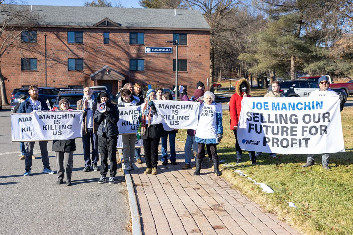 Climate activists hold a protest outside of a "Politics & Eggs" event where Sen. Joe Manchin is speaking at the New Hampshire Institute Politics at St. Anselm College on January 12, 2024 in Manchester, New Hampshire. (Scott Eisen/Getty Images)