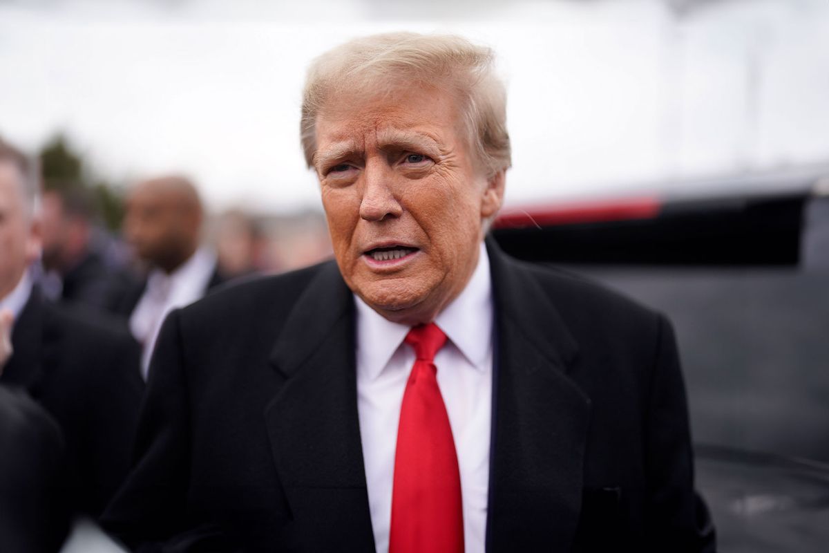 Former president Donald Trump speaks to the media after speaking outside a polling location on Tuesday, January 23, 2024 at Londonderry High School in Londonderry, NH. (Jabin Botsford/The Washington Post via Getty Images)