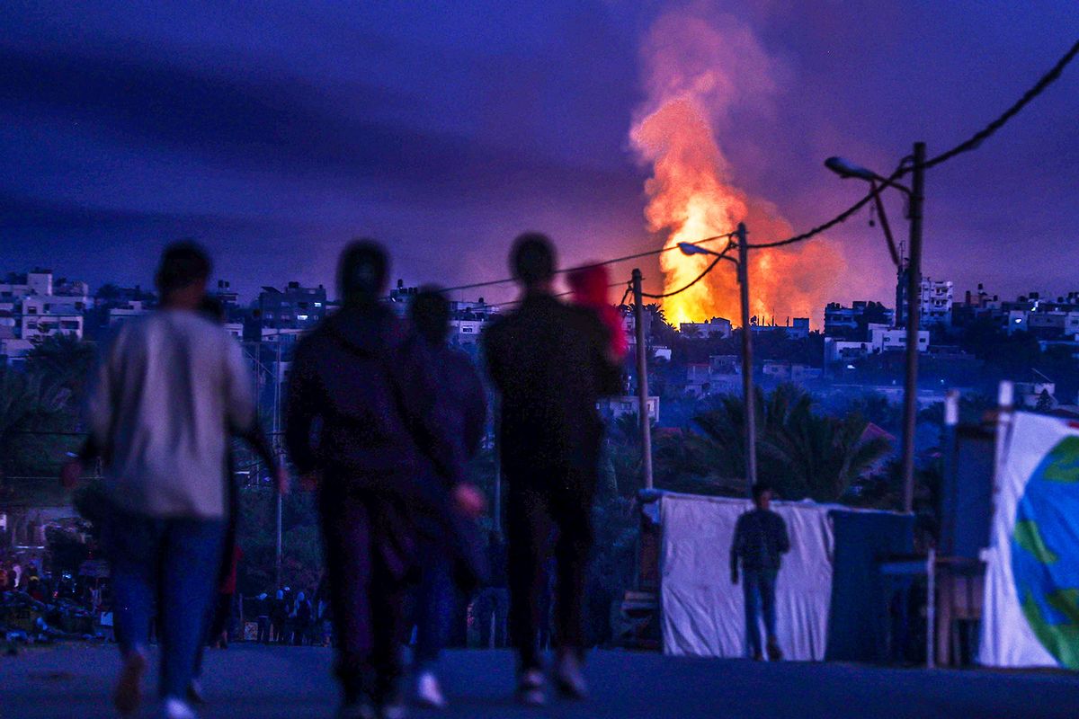 Smoke and flame rises from different parts of Salah al-Din Road following Israeli attacks in Deir Al Balah, Gaza on January 07, 2024. (Ali Jadallah/Anadolu via Getty Images)