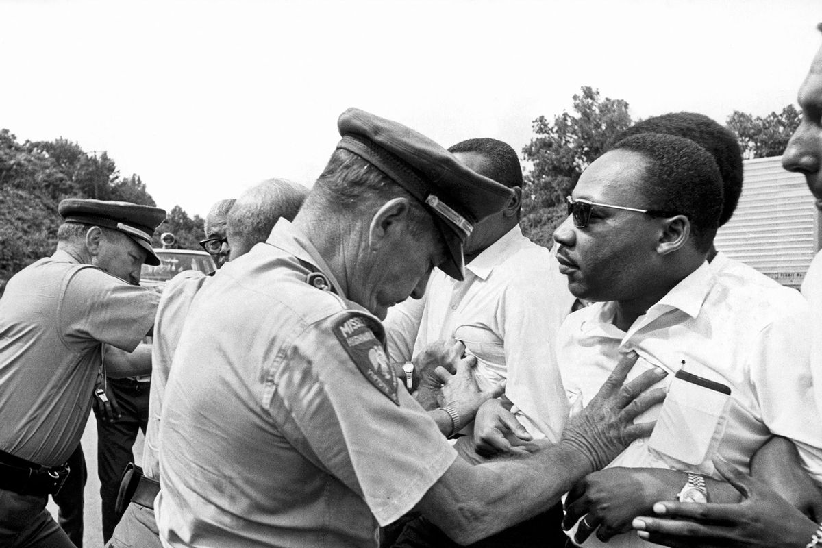 Dr. Martin Luther King being shoved back by Mississippi patrolmen during the 220 mile 'March Against Fear' from Memphis, Tennessee to Jackson, Mississippi, Mississippi, June 8, 1966. (Underwood Archives/Getty Images)