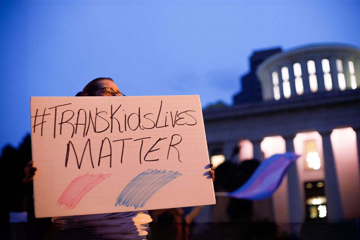 Transgender rights advocate holds a sign outside the Ohio Statehouse during the rally. (Stephen Zenner/SOPA Images/LightRocket via Getty Images)
