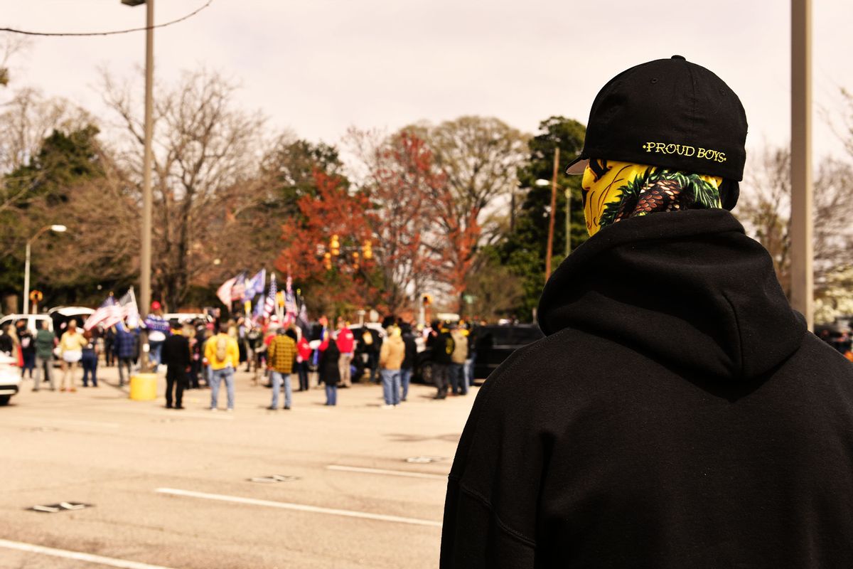 About one hundred supporters of World Wide Rally for Freedom and Democracy along with two dozen Proud Boys attend a gathering to impeach Governor Roy Cooper and for the return of constitutional freedoms in Raleigh, NC, United States on March 20, 2021. (Peter Zay/Anadolu Agency via Getty Images)