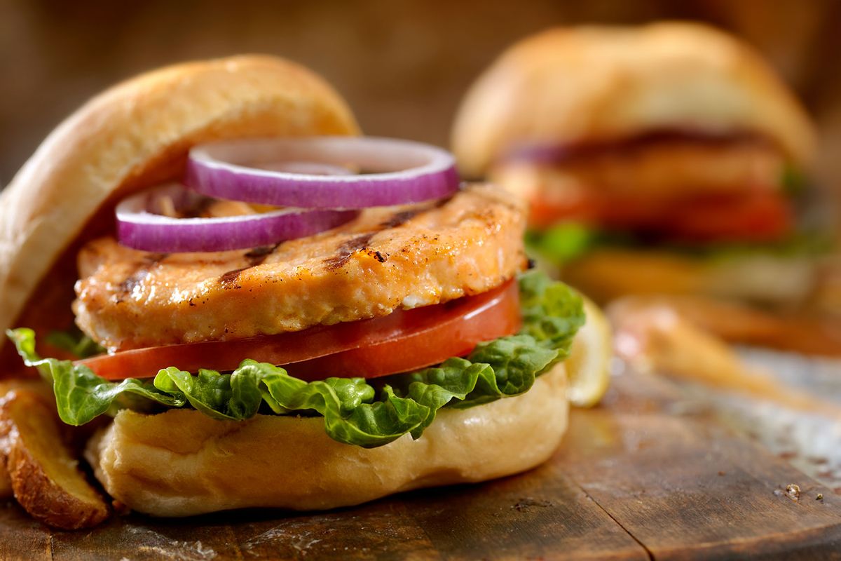 Salmon Burger with Red Onion, Lettuce, Tomato and Fries (Getty Images/LauriPatterson)