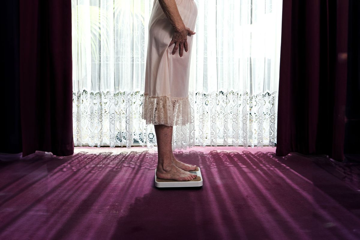 Senior Woman Standing On Scale (Getty Images/Karan Kapoor)