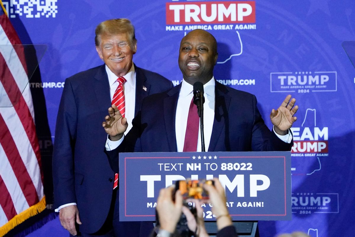US Republican Senator from South Carolina Tim Scott speaks as Republican presidential hopeful and former US President Donald Trump listens during a campaign event in Concord, New Hampshire, on January 19, 2024.  (TIMOTHY A. CLARY/AFP via Getty Images)