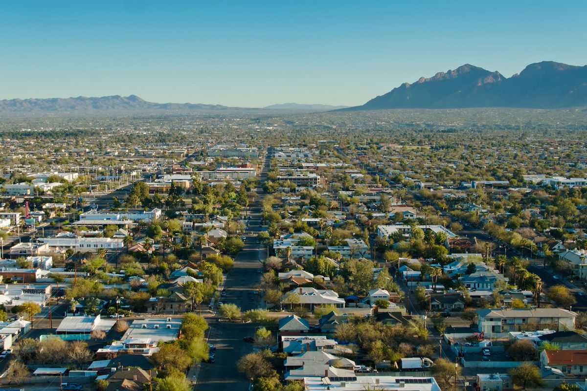 Residential and commercial properties stretch to the mountains beyond Tucson, Arizona. (Getty Images/halbergman)