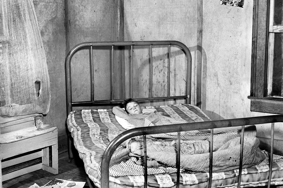 Young Boy in Bed with Measles in Home of U.S. Farm Security Administration (FSA) Borrower, Greene County, Georgia, USA, Jack Delano. circa June, 1941. (Circa Images/GHI/Universal History Archive/Universal Images Group via Getty Images)