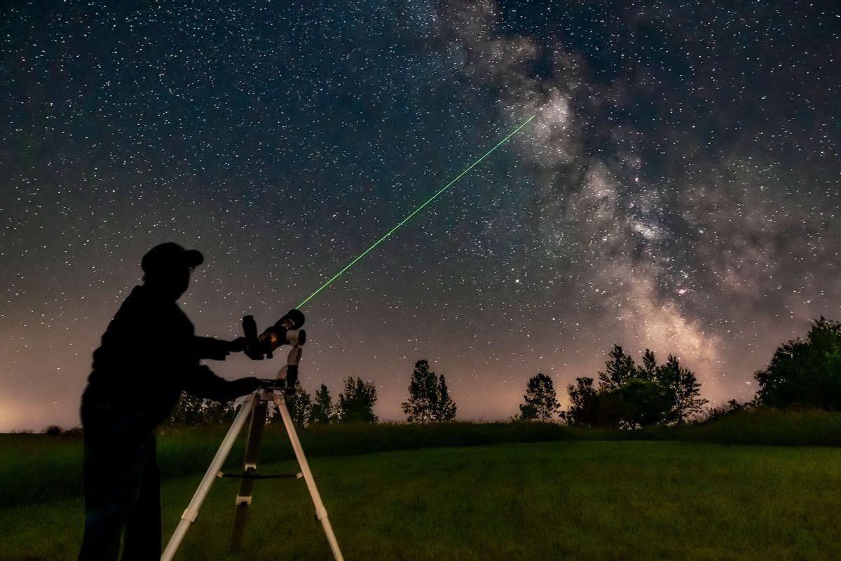 Aiming the A&M 80mm refractor on the Astro-Tech Voyager mount at the Milky Way with its laser pointer finder showing the way. (Alan Dyer/VWPics/Universal Images Group via Getty Images)