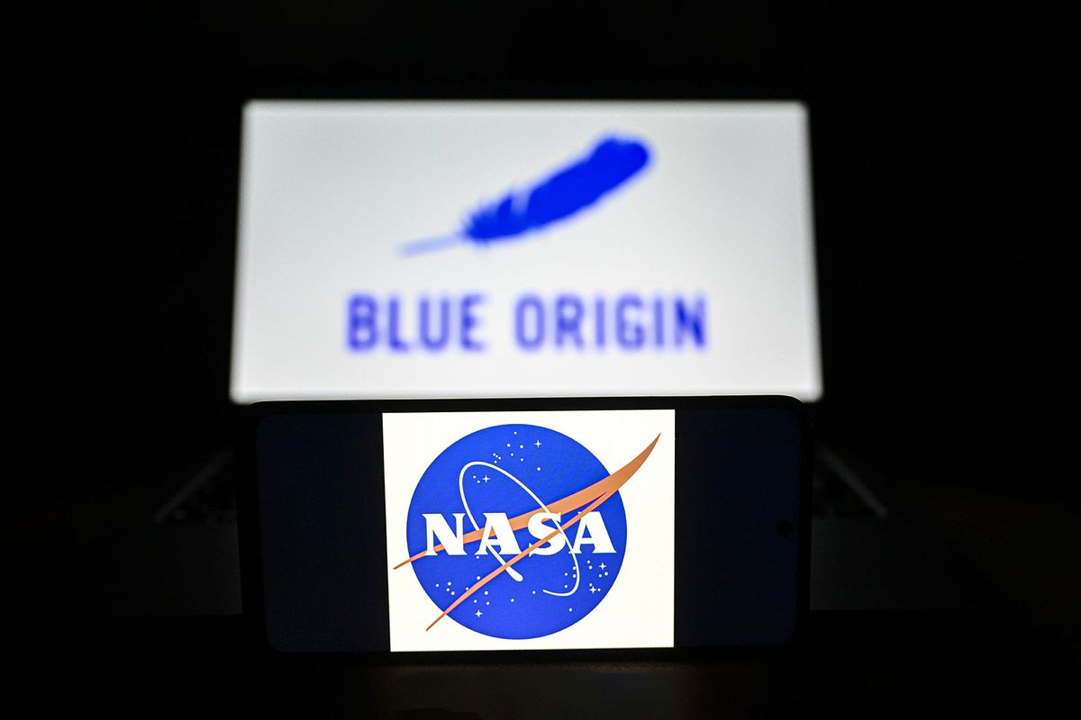Logo of NASA is displayed on mobile phone screen in front of Blue Origin icon on February 27, 2023. (Metin Aktas/Anadolu Agency via Getty Images)