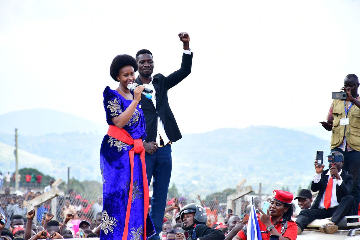 Bobi Wine on top of his vehicle with his wife Barbara Itungo Kyagulanyi as they campaigned in Kasanda district, Central Uganda on November 27, 2020. (Southern Films/Lookman Kampala)