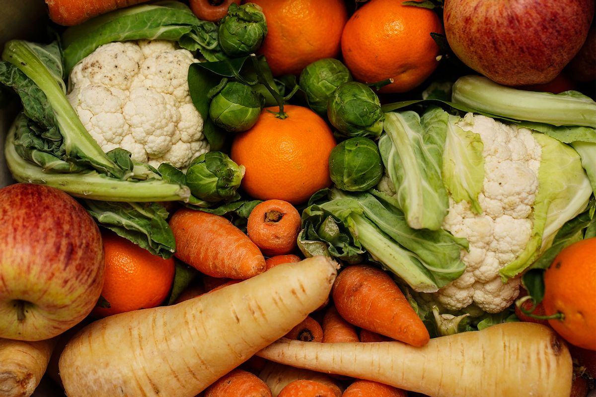 Crate of fresh fruit and vegetables, including carrots, cauliflower, parsnips, brussel sprouts, apples and oranges. (David Davies/PA Images via Getty Images)