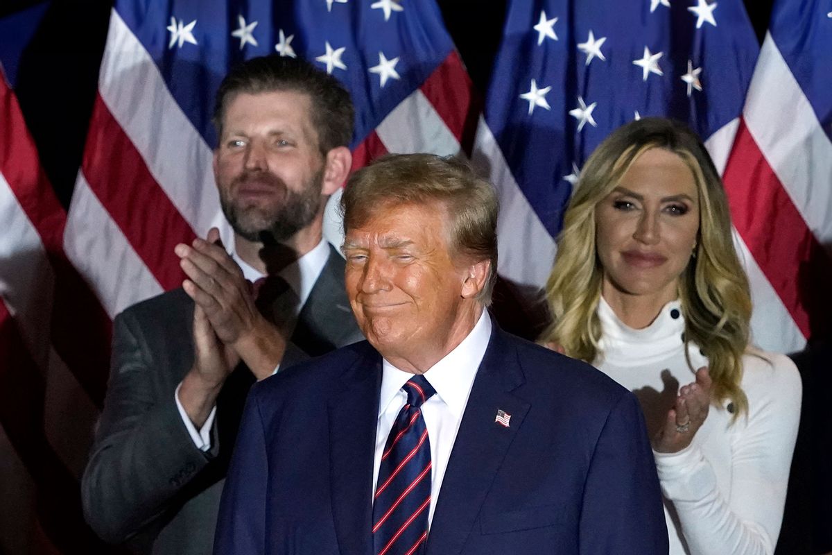 Republican presidential hopeful and former US President Donald Trump looks on, flanked by son Eric Trump (L) and daughter-in-law Lara Trump, during an Election Night Party in Nashua, New Hampshire, on January 23, 2024. (TIMOTHY A. CLARY/AFP via Getty Images)