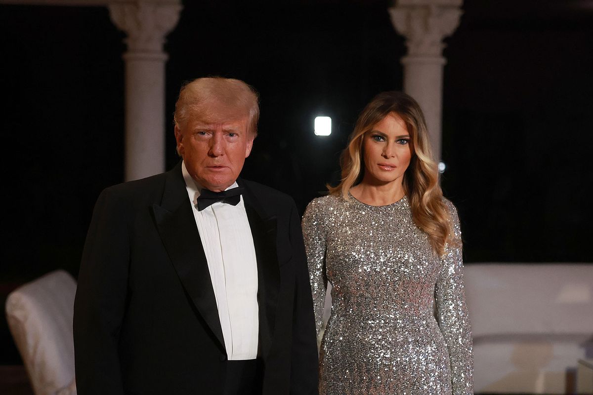 Former U.S. President Donald Trump and former first lady Melania Trump arrive for a New Years event at his Mar-a-Lago home on December 31, 2022 in Palm Beach, Florida. (Joe Raedle/Getty Images)