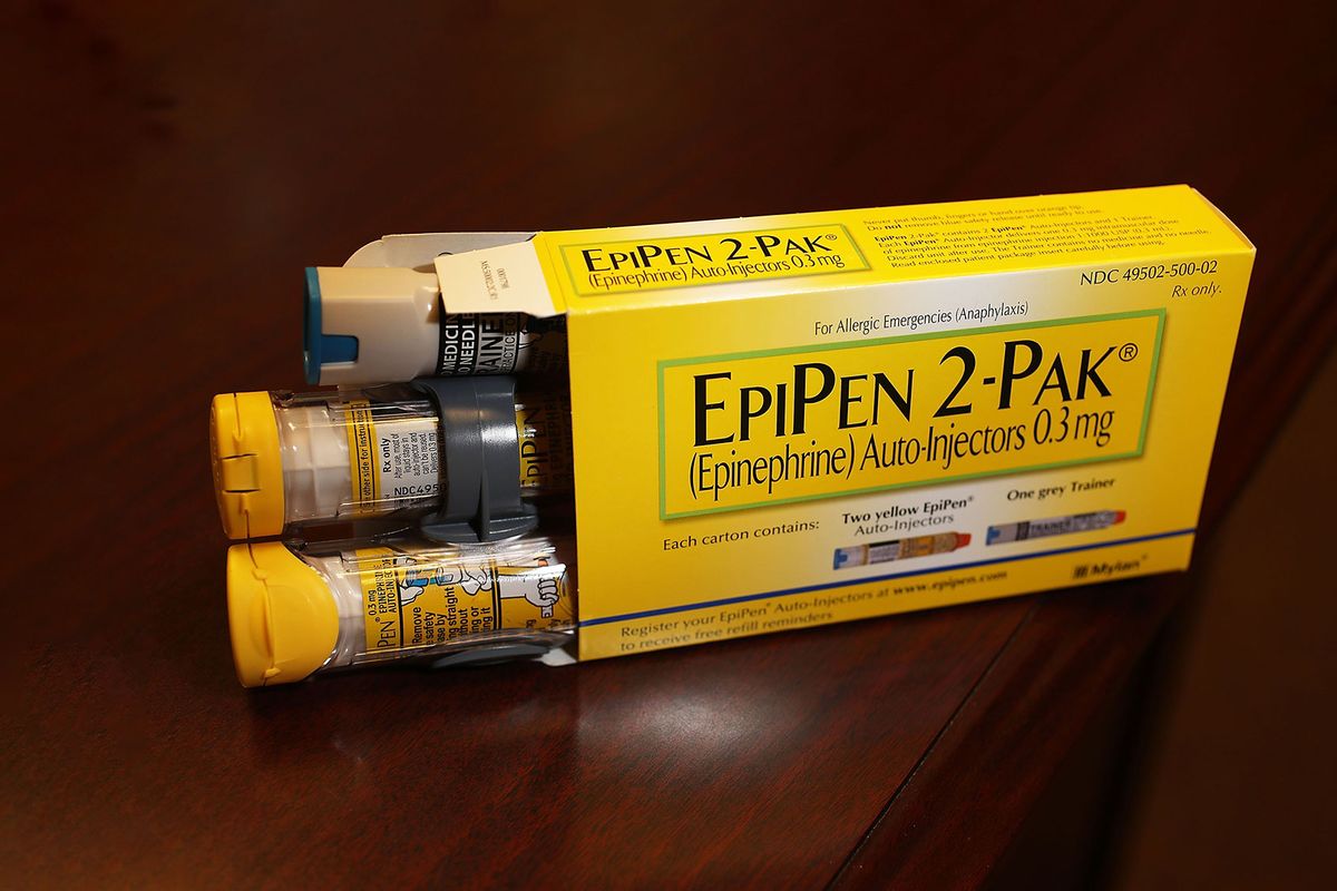 In this photo illustration, EpiPen, which dispenses epinephrine through an injection mechanism for people with severe allergies, is seen as the company that makes it Mylan Inc. has come under fire from consumers and lawmakers for the price that it is currently charging on August 16, 2016 in Hollywood, Florida. (Photo Illustration by Joe Raedle/Getty Images)