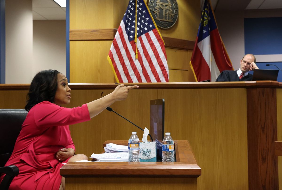 District Attorney Fani Willis speaks from a witness stand in front of Fulton County Superior Judge Scott McAfee during a hearing in the case of State of Georgia v. Donald John Trump at the Fulton County Courthouse on February 15, 2024 in Atlanta, Georgia.  ( Alyssa Pointer-Pool/Getty Images)