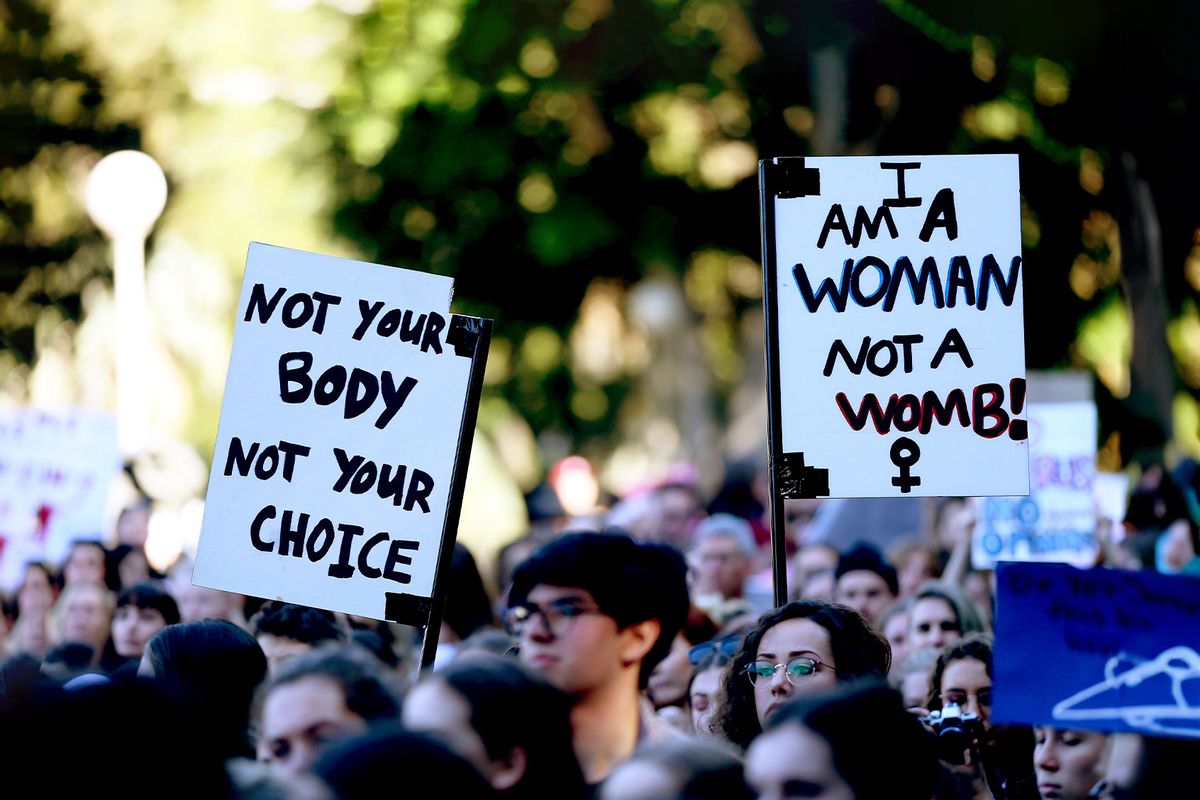 Signage can be seen at Hyde Park on June 09, 2019 in Sydney, Australia. The march was organised by a Sydney high school student in response to Alabama's new abortion laws in the US. (Don Arnold/Getty Images)