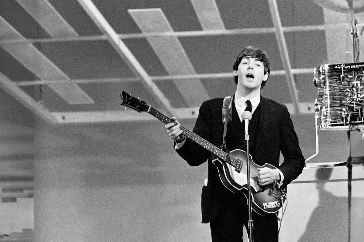 Paul McCartney playing guitar in New York during the Beatles first tour of America. February 1964. (Daily Mirror/Daily Mirror/Mirrorpix via Getty Images)