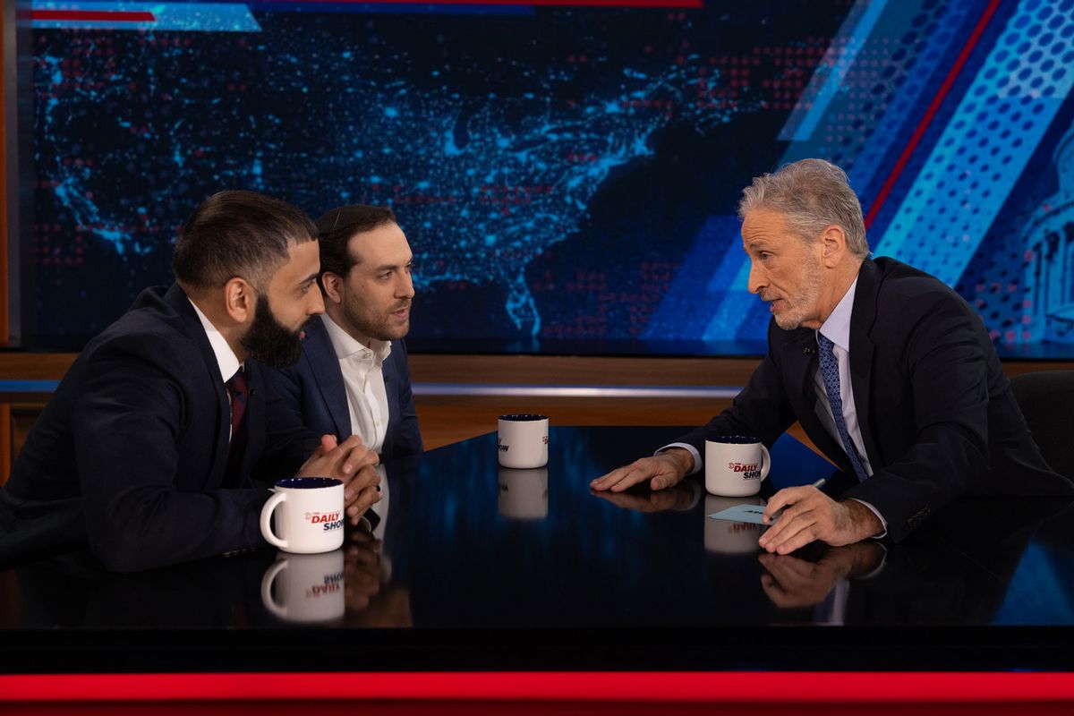 The Intercept’s Murtaza Hussain and Yair Rosenberg of The Atlantic discuss with Jon Stewart how peace may be possible between Israel and Palestine on "The Daily Show" (Courtesy of Comedy Central)