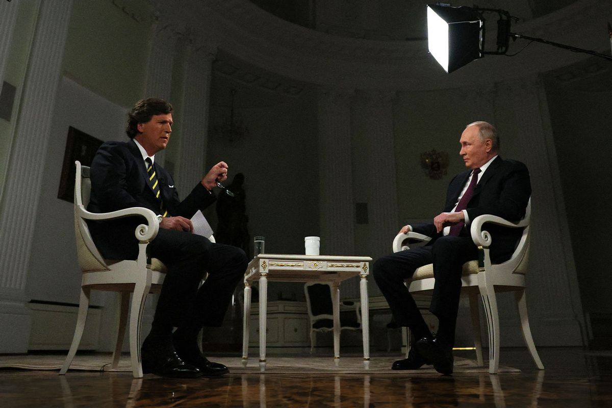 In this pool photograph distributed by Russian state agency Sputnik, Russia's President Vladimir Putin gives an interview to US talk show host Tucker Carlson at the Kremlin in Moscow on February 6, 2024. (GAVRIIL GRIGOROV/POOL/AFP via Getty Images)
