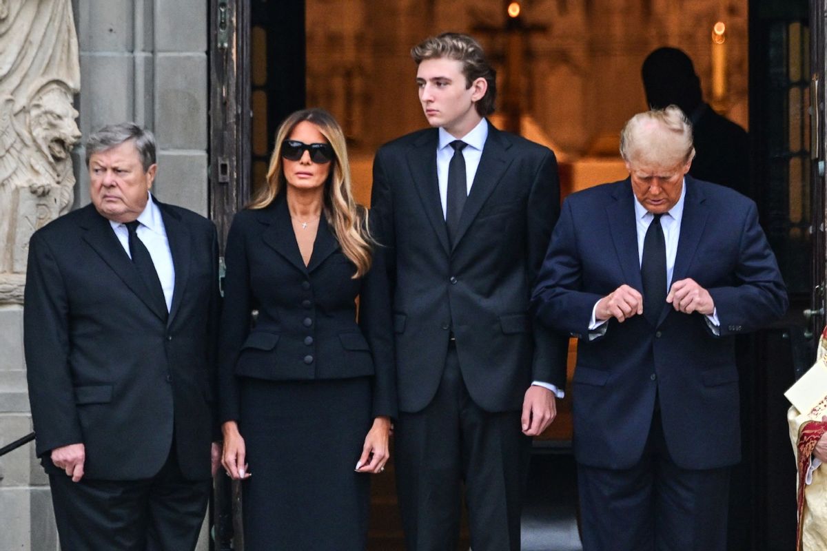Former U.S. President Donald Trump (R) stands with his wife Melania Trump (2L) their son Barron Trump (C) and father-in-law Viktor Knavs, at the start of a funeral for Amalija Knavs, the former first lady's mother, outside the Church of Bethesda-by-the-Sea, in Palm Beach, Florida, on January 18, 2024.  (GIORGIO VIERA/AFP via Getty Images)
