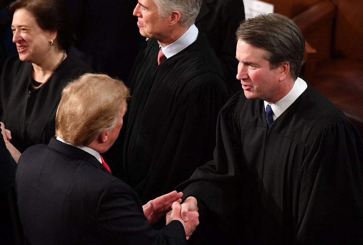 Former President Donald Trump shakes hands with Supreme Court Justice Brett Kavanaugh before delivering the State of the Union address on February 5, 2019. (MANDEL NGAN/AFP via Getty Images)