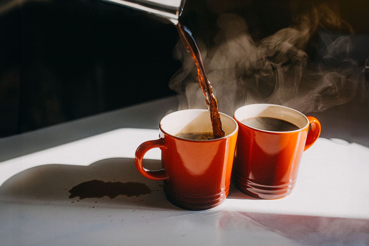 Coffee Pouring in Two Mugs (Getty Images/Stefania Pelfini, La Waziya Photography)