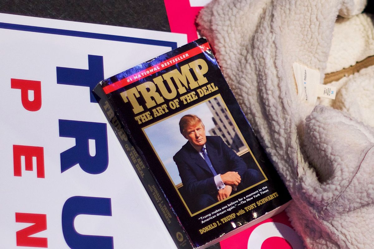 Donald Trump's book 'The Art Of The Deal' laid on campaign posters at a Trump rally on December 15, 2016 at Giant Center in Hershey, Pennsylvania. (Mark Makela/Getty Images)