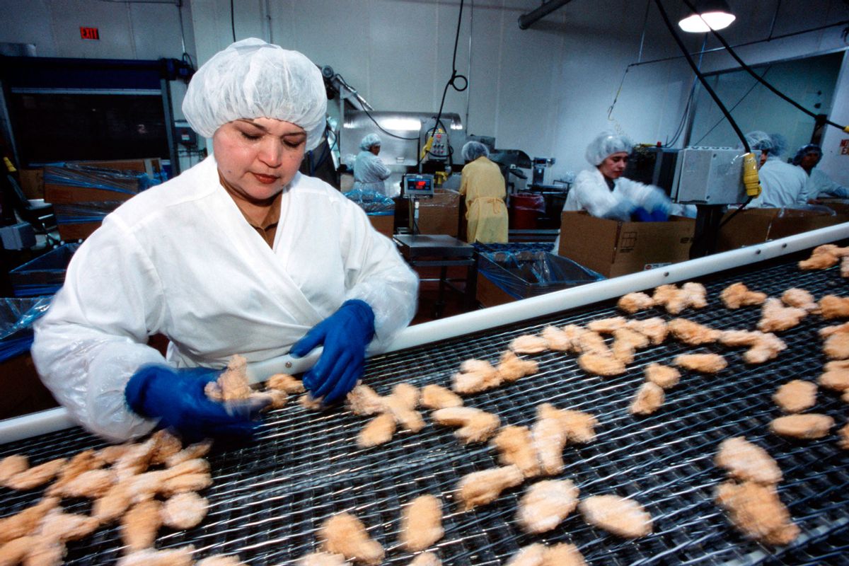 Employees of Tyson Foods Inc. process chicken. (Greg Smith/Corbis via Getty Images)