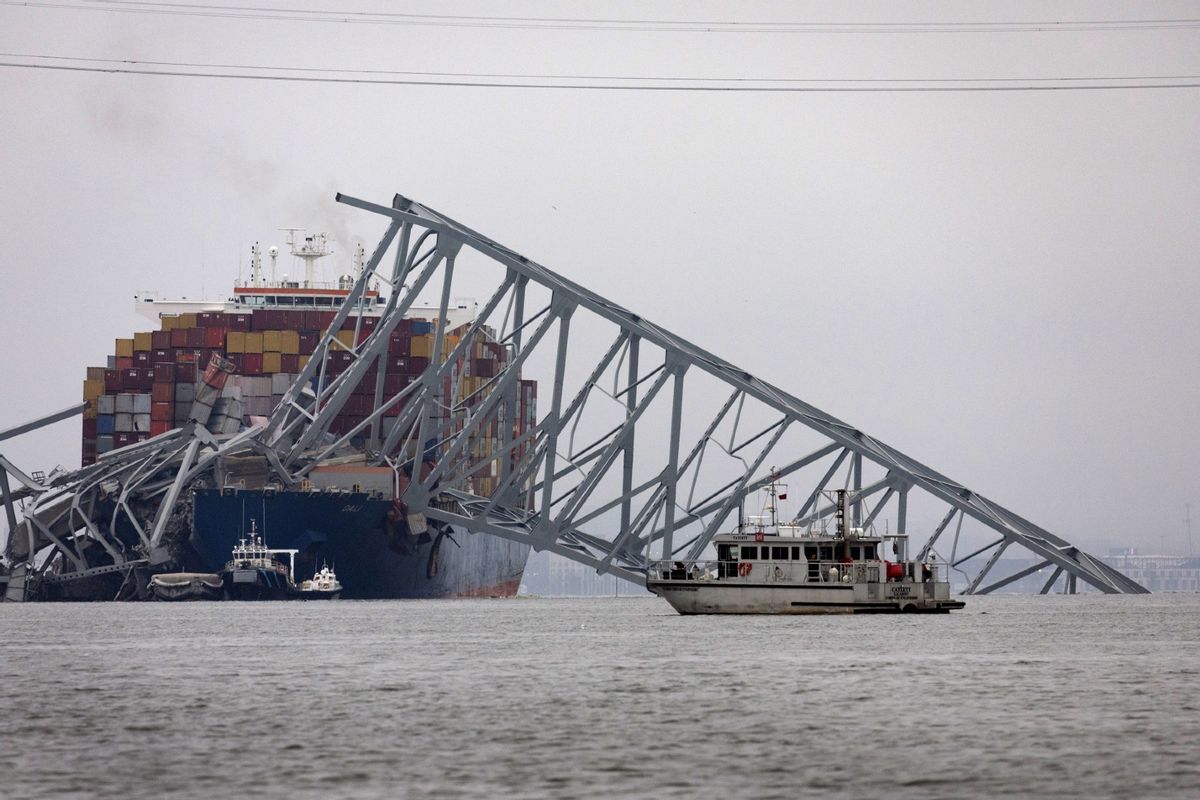 Workers continue to investigate and search for victims at the scene after the cargo ship Dali collided with the Francis Scott Key Bridge yesterday causing it to collapse, on March 27, 2024 in Baltimore, Maryland.  (Scott Olson/Getty Images)