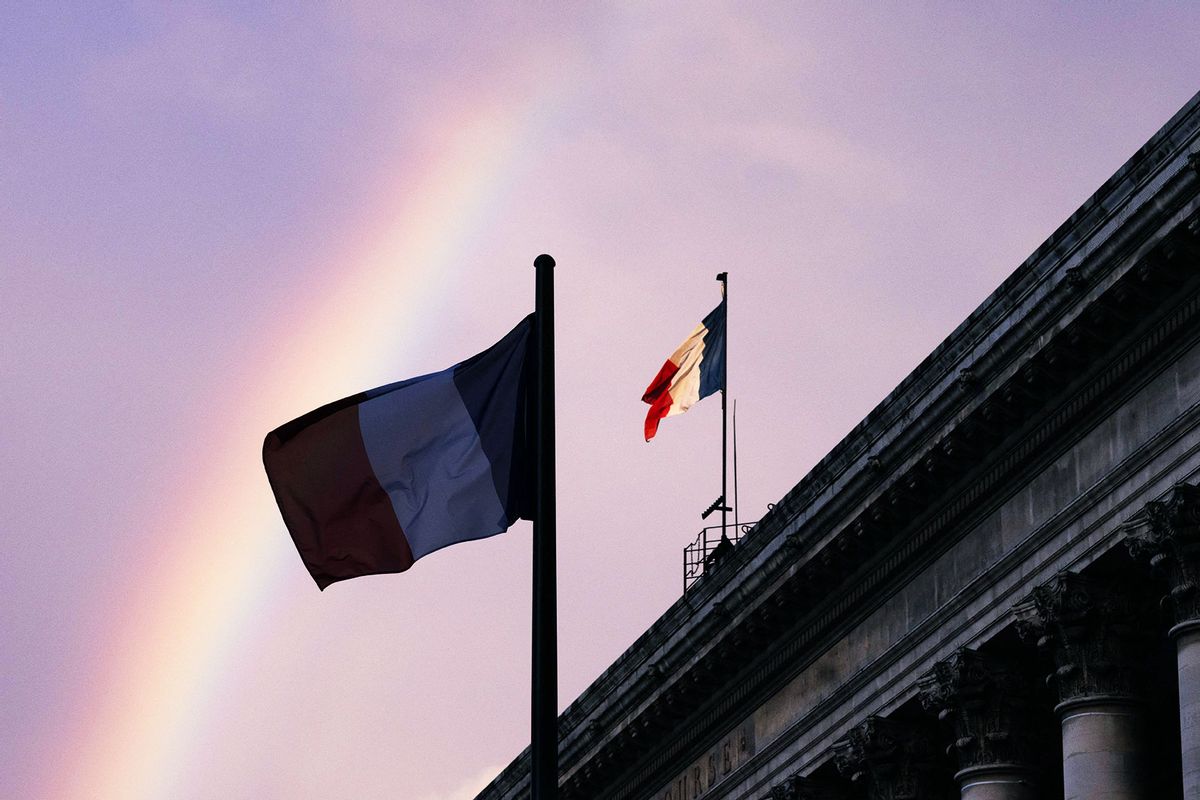Rainbow over French flags in central Paris. (JOEL SAGET/AFP via Getty Images)