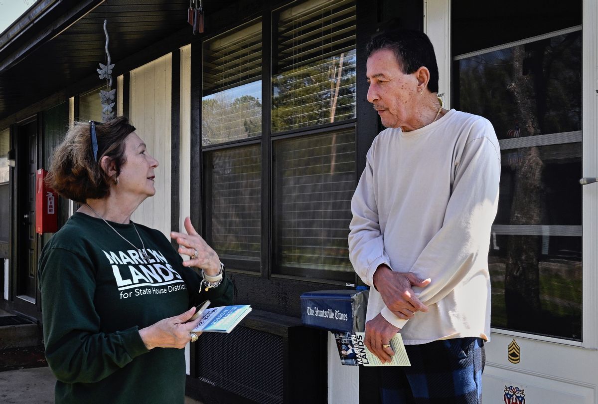 Democratic candidate Marilyn Lands walked the streets in the suburbs in Huntsville, Alabama looking to convince voters to support her on March 20, 2024. She chatted with (R) Nestor Centeno (a retired Army man) as the special election is on the horizon. (Michael S. Williamson/The Washington Post via Getty Images)